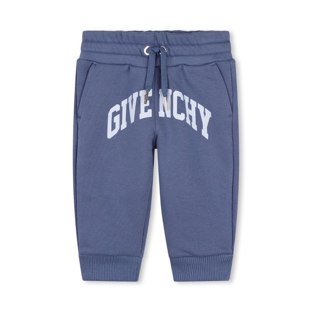 Givenchy Baby Boys blue cotton joggers with a large varsity-style front logo, elasticated drawstring waistband, and a fleecy feel inside, available at Lestyle Boutique 136 Little Collins St.