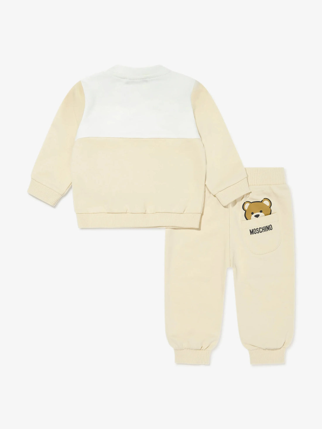 Moschino Kids Baby beige tracksuit set from the SS2025 collection, including a color-block (white/beige) sweatshirt with Teddy Bear motif and matching beige pants, available at Lestyle Boutique 136 Little Collins St.
