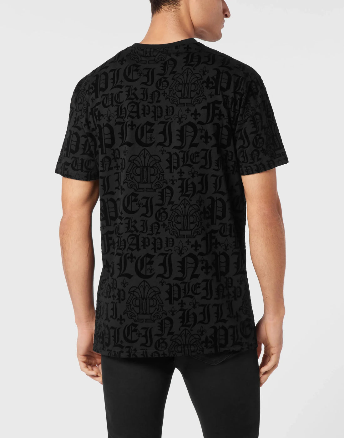 Philipp Plein black cotton jersey t-shirt with a round neck, short sleeves, an all-over tonal flocked Gothic pattern, and a logoed patch, available at Lestyle Boutique 136 Little Collins St.