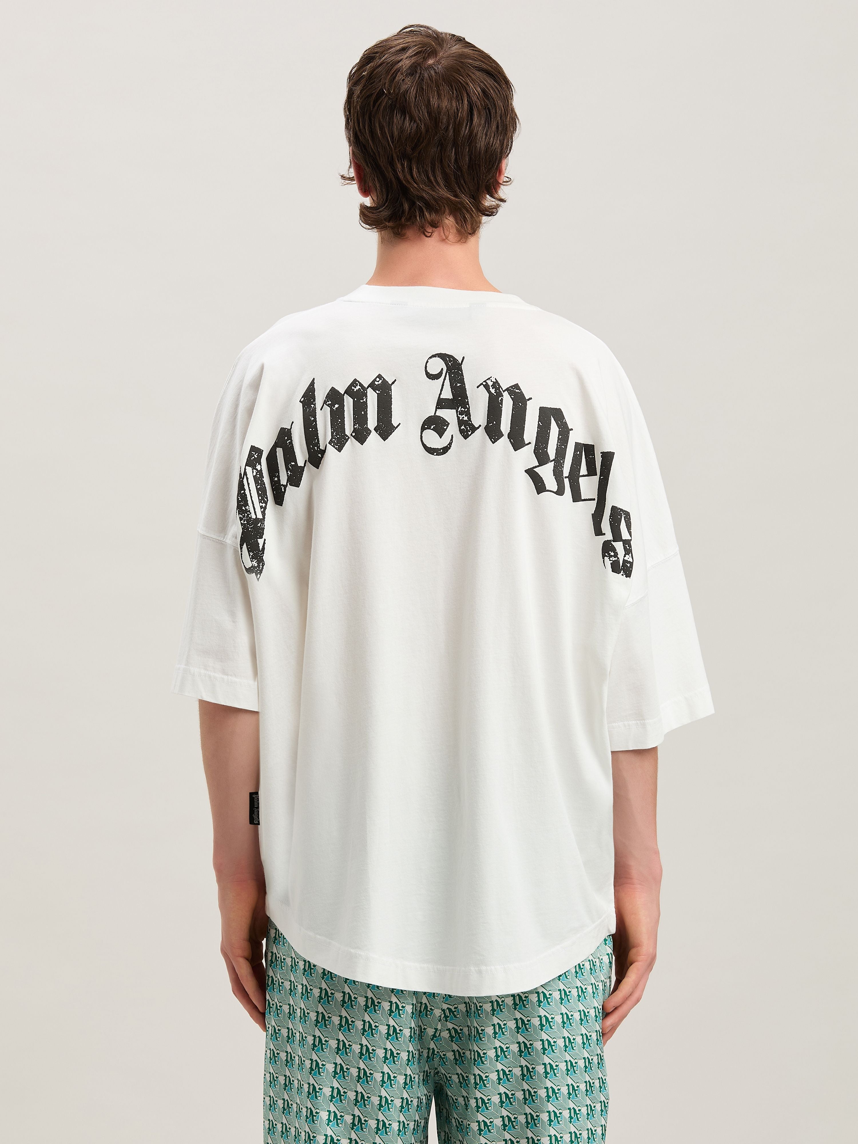 Palm Angels T-shirt featuring curved black logo available at Lestyle Boutique Melbourne