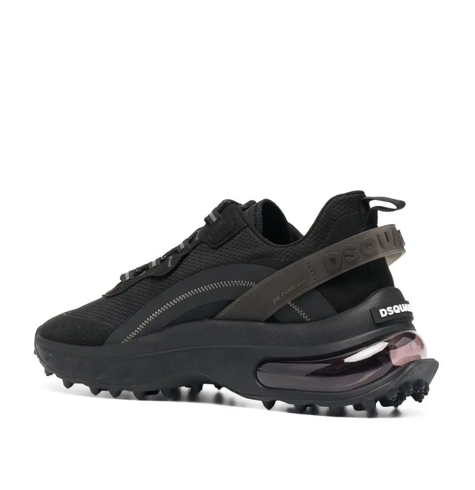 Dsquared2 black low-top sneakers featuring a logo print strap, lace-up fastening, pull-tab, and a chunky ridged rubber sole, available at Lestyle Boutique 136 Little Collins St.