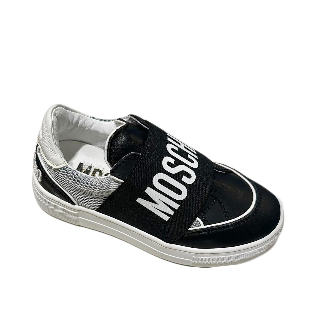 Moschino black and silver slip-on sneakers with a wide logo strap, mixed materials, and a white sole, available at Lestyle Boutique 136 Little Collins St.