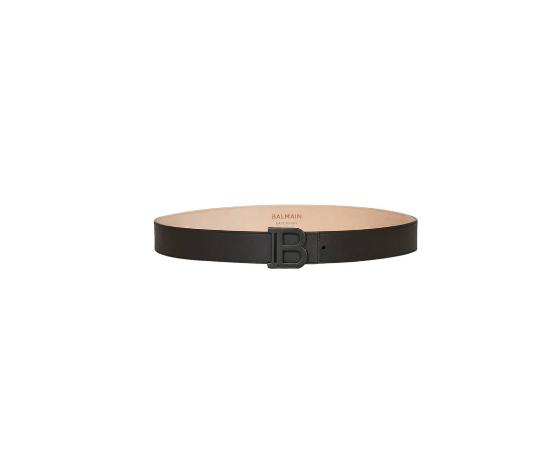 Luxury Balmain black calf leather belt featuring a distinctive logo buckle. This premium accessory showcases punch-hole detailing for an adjustable fit, making it a versatile addition to any wardrobe. Ideal for both casual and formal occasions, this designer piece offers a blend of style and functionality, available at Lestyle Boutique Melbourne.