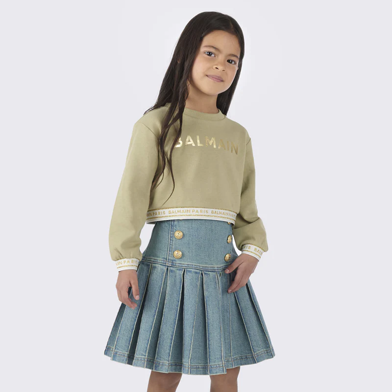 Balmain kids sweatshirt in a stylish green hue, crafted from premium 100% cotton for comfort and durability. This designer piece features a crew neck and a bold logo print, making it a standout addition to any child's wardrobe. Perfect for casual outings or playdates, this luxury sweatshirt combines quality and style effortlessly, available at Lestyle Boutique Melbourne.