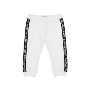 White sweatpants with Balmain logo stripes on a white background