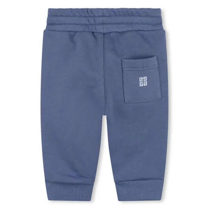 Givenchy Baby Boys blue cotton joggers with a large varsity-style front logo, elasticated drawstring waistband, and a fleecy feel inside, available at Lestyle Boutique 136 Little Collins St.