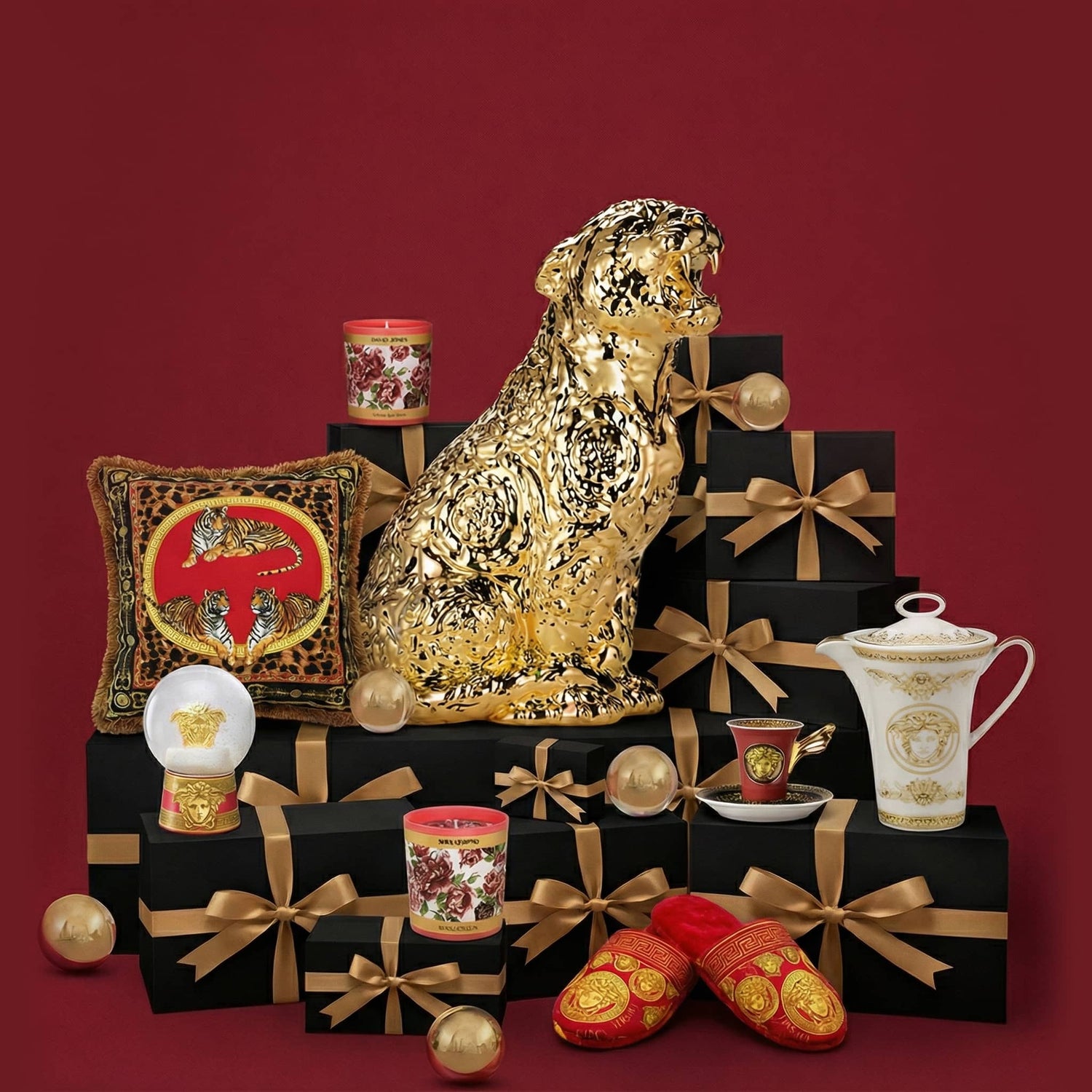Decorative items including a gold panther statue, black boxes with gold bows, and a red and gold shoe on a red background.