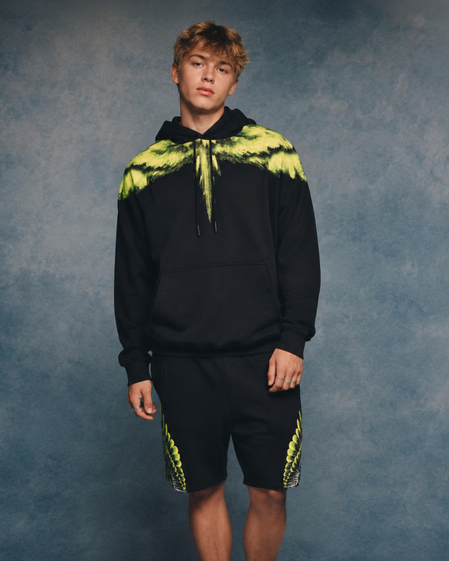 Marcelo Burlon County of Milan black hoodie with green wings print, made from 100% cotton, available at Lestyle Boutique Melbourne.