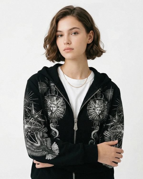 Person wearing a black Philipp Plein hoodie with intricate designs on a white background