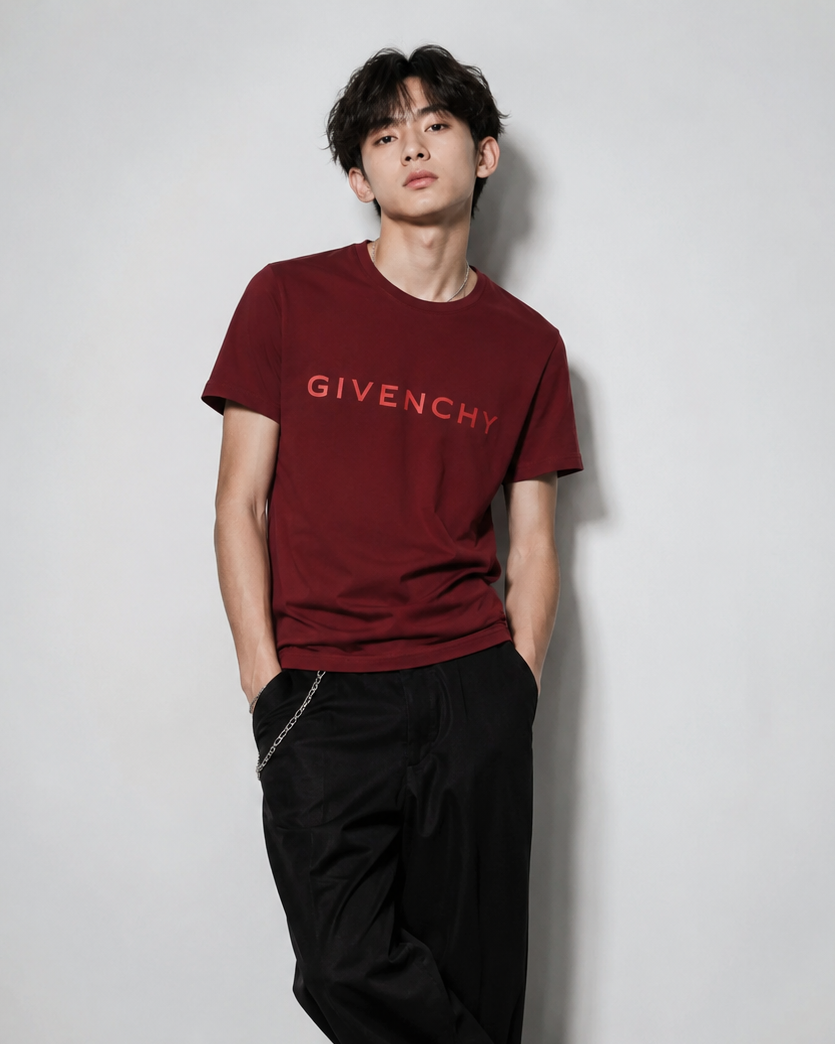 Person wearing a Givenchy t-shirt against a plain background