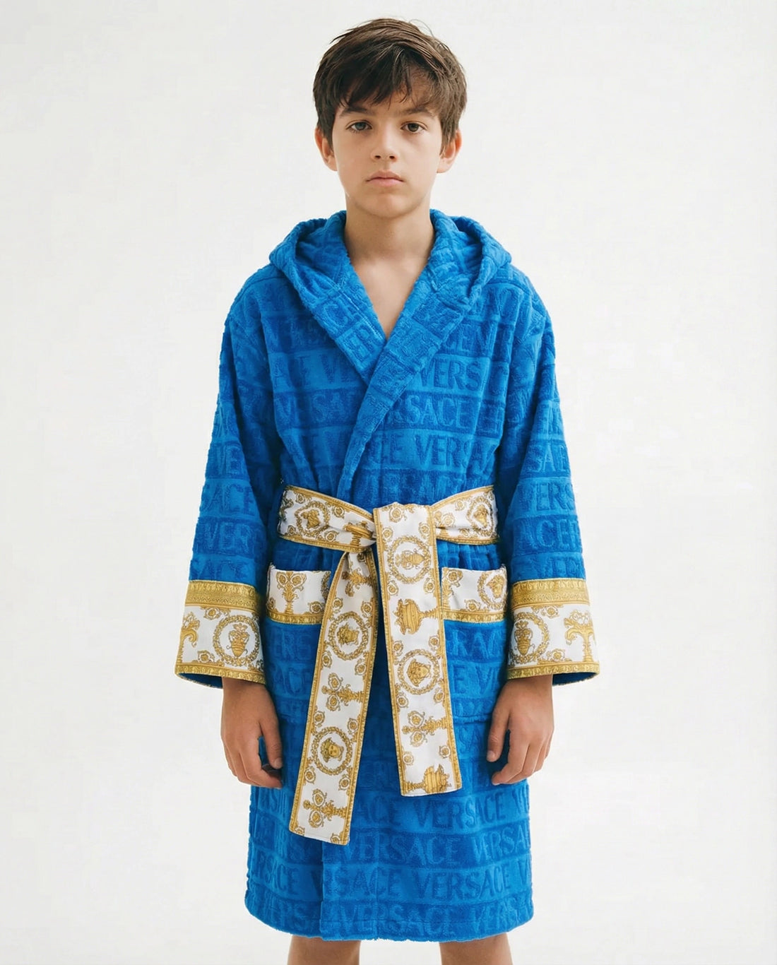Versace Kids Belted Logo Monogram Hooded Robe in blue with gold baroque detailing, featuring an all-over Versace monogram print, a hooded design, and a belted waist, available at Lestyle Boutique.