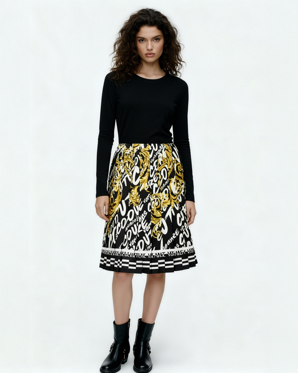 Versace Jeans Couture black long-sleeve combo dress in 100% polyester, featuring a solid top and a multi-color logo print skirt, available at Lestyle Boutique 136 Little Collins St.