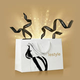 White shopping bag with black shoe design and 'lestyle' branding on a gold background