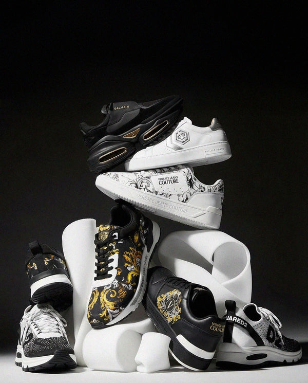 Collection of stylish sneakers in various designs and colors on a black background