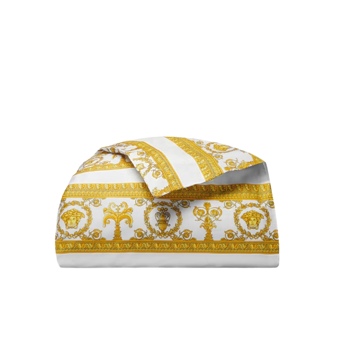 Folded fabric with gold and white pattern on a white background, available at Lestyle Boutique 136 Little Collins St.