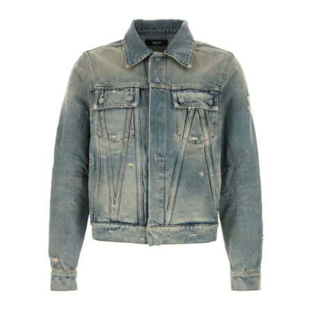 A classic blue denim jacket by AMIRI, available at Lestyle Boutique. Crafted from 100% cotton, this jacket features a timeless design with a washed finish, button-up closure, and chest flap pockets.