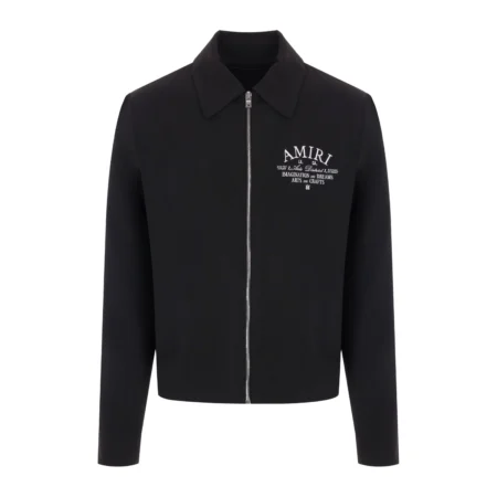 A black wool jacket by AMIRI with white embroidered logo detailing, available at Lestyle Boutique. This jacket features a spread collar, front zip closure, and press-stud cuffs for a sleek and stylish look.