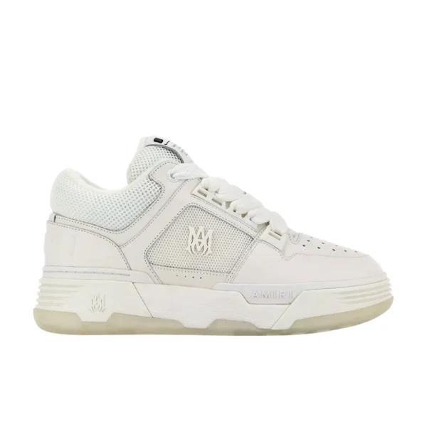 A pair of all white MA 1 low top sneakers by AMIRI available at Lestyle Boutique Featuring a leather upper mesh panels and signature MA logo detailing these sneakers offer a refined and modern look