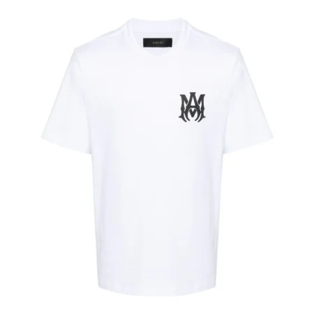A white cotton t-shirt by AMIRI, available at Lestyle Boutique. Featuring an MA monogram logo on the chest and a bold AMIRI logo on the back, this tee offers classic design with elevated details.