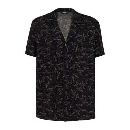 Balmain black short-sleeve shirt featuring an all-over logo print, poplin texture, and a notched collar, available at Lestyle Boutique.