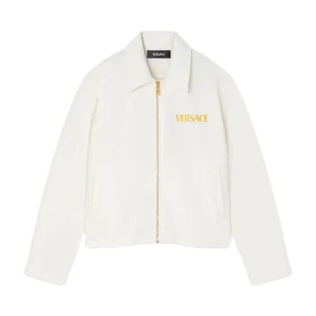 Versace Medusa Garland Kids Zip Polo Shirt in white, featuring long sleeves, a pointed collar, a front zip closure, and signature Medusa Garland detailing, available at Lestyle Boutique.