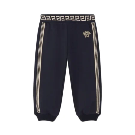 Versace Kids Greca Sweatpants in blue, featuring a ribbed Greca waistband, Medusa embroidery, and striped side panels, available at Lestyle Boutique.