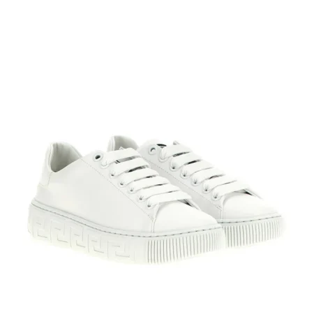 Versace Kids Greca Sneakers in white, featuring a smooth leather upper, lace-up design, and signature Greca-patterned rubber sole, available at Lestyle Boutique.