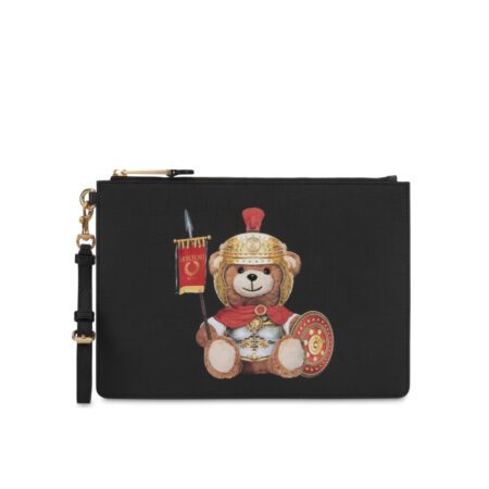 Moschino black clutch featuring a multicolor Roman Teddy Bear print, top zip closure with gold-tone hardware, and a detachable wrist strap, available at Lestyle Boutique 136 Little Collins St.