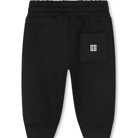 Givenchy Kids black and white cotton blend track pants with 4G-motif, front logo print, and elasticated drawstring waistband, available at Lestyle Boutique 136 Little Collins St.